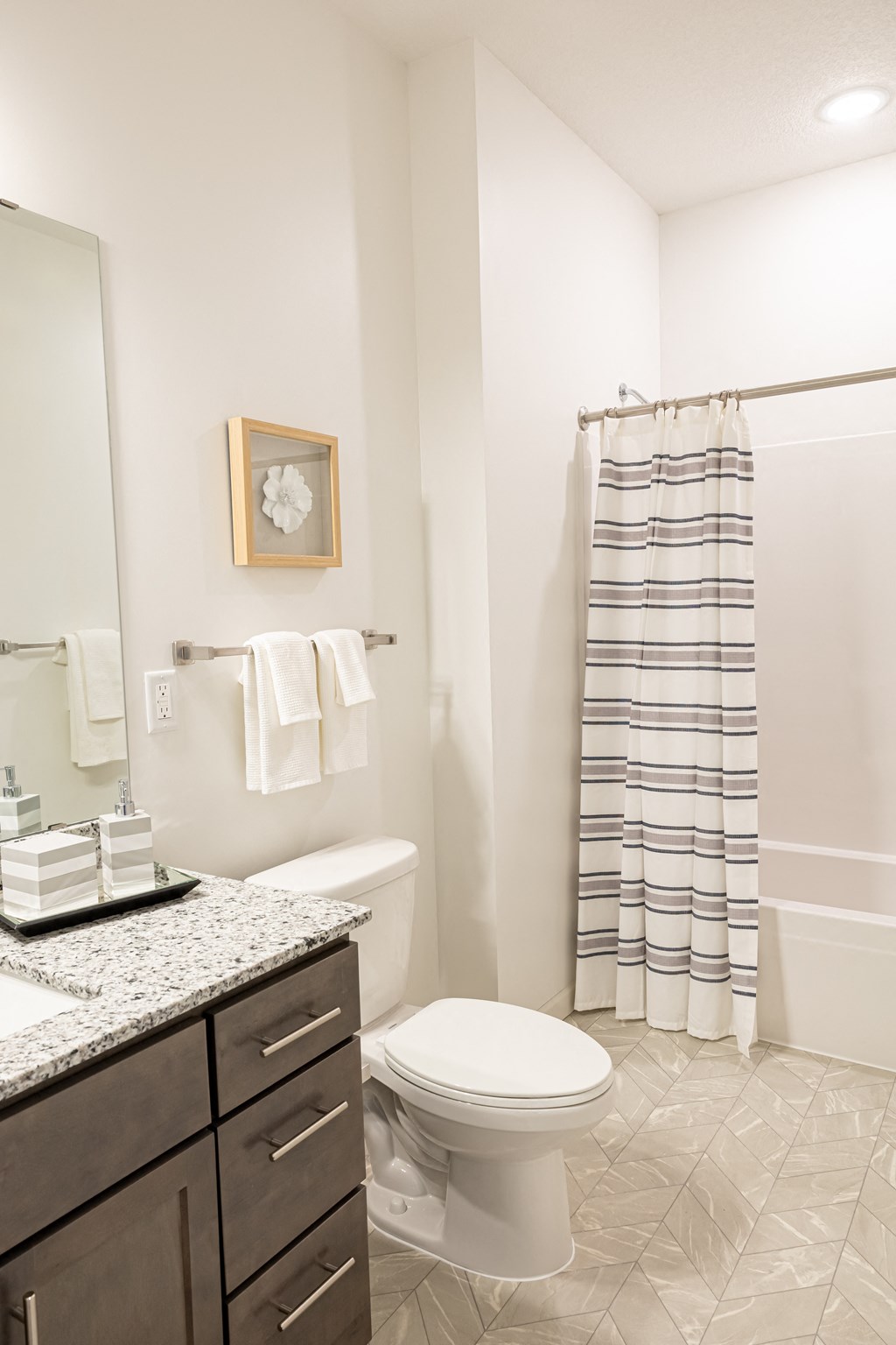 a small bathroom with a toilet and a shower and a sink