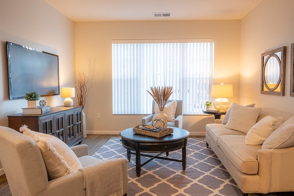 a living room with couches and a coffee table
