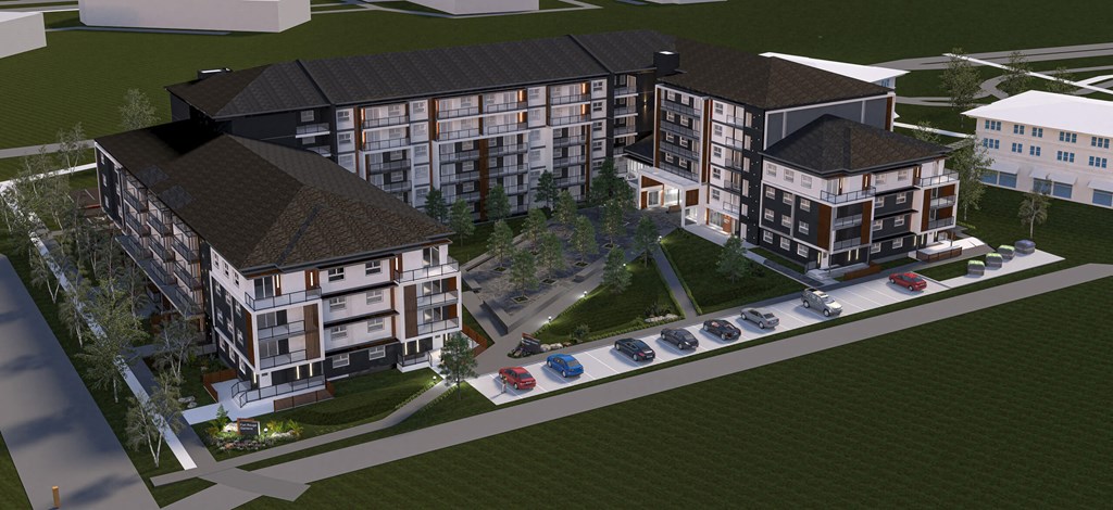 an aerial view of the apartment building with cars parked in front of it