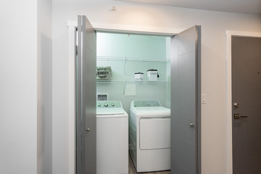 a laundry room with two washes and a dryer in it