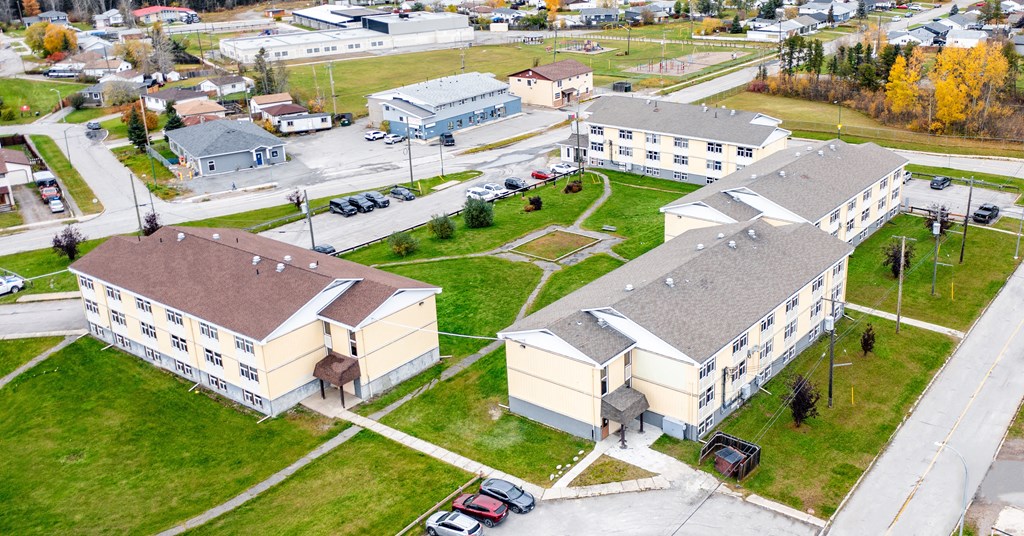 An aerial view of a large building complex with multiple buildings and parking lots.