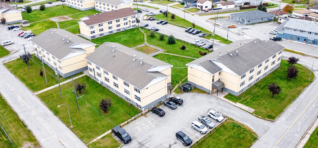 A parking lot is in front of a building.