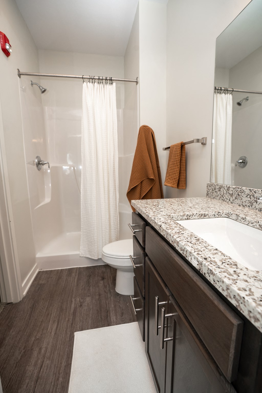 the residence on lamar apartment bathroom with sink toilet and shower