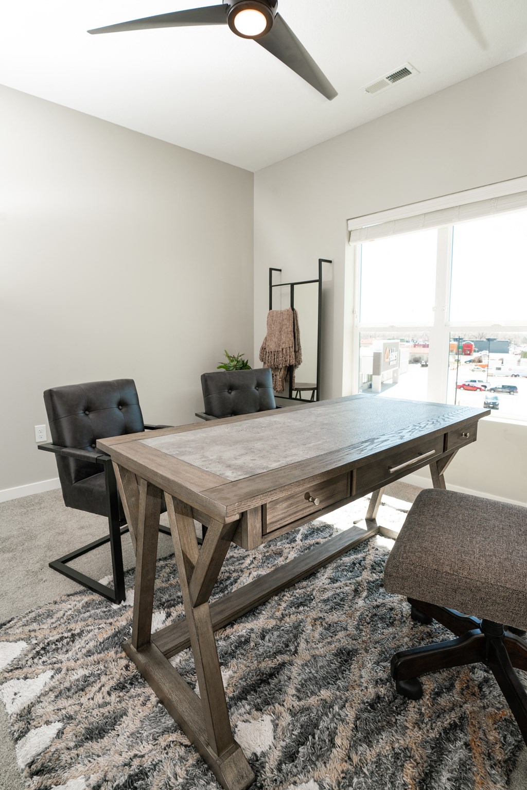 a dining room with a wooden table and two chairs