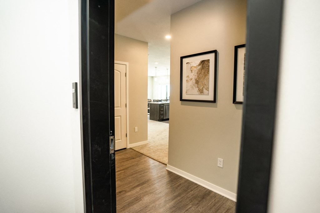 a view of a living room from the hallway of a house