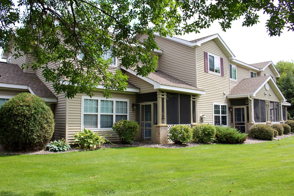 exterior of townhomes with beautiful landscaping