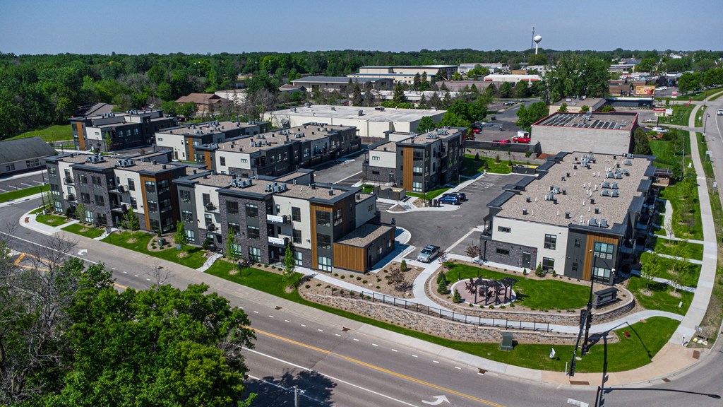 an aerial view of an urban area with buildings and a road