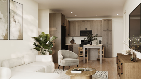 A modern living room with a white sofa, a wooden coffee table, and a kitchen area in the background.