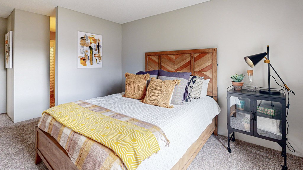 a bedroom with a bed and a desk