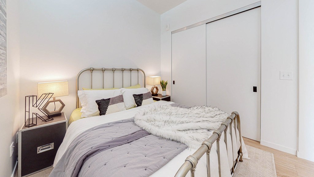 Cozy bed at CityLine Apartments, Minneapolis, Minnesota