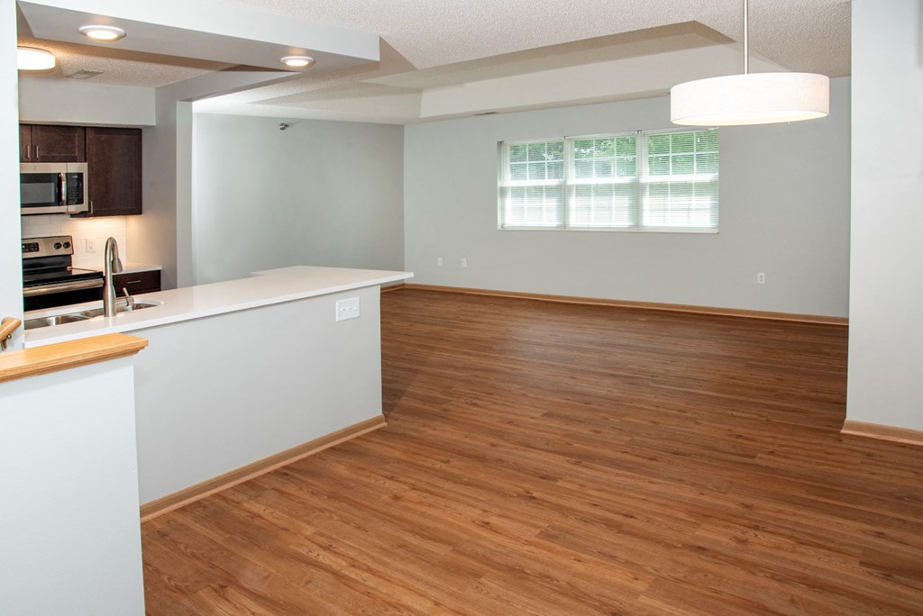 1 bedroom Wood-look flooring throughout living, dining and kitchen