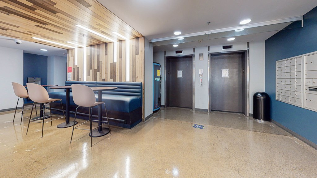 resident lounge with seating, elevators at Bierman Place, Minneapolis, Minnesota