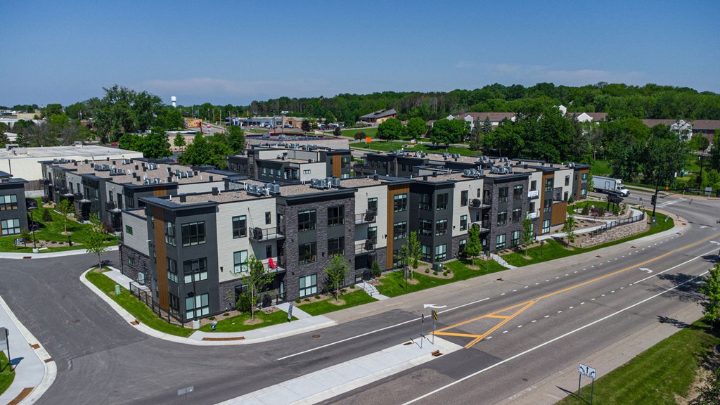 an aerial view of apartment buildings on a city street