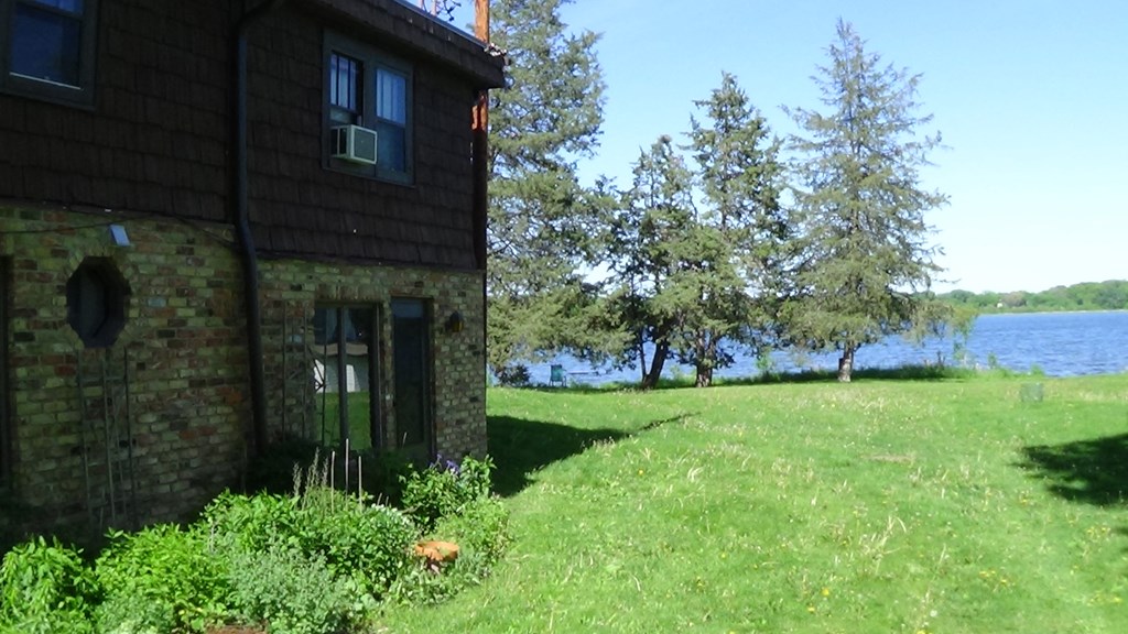 a house with a lake in the background