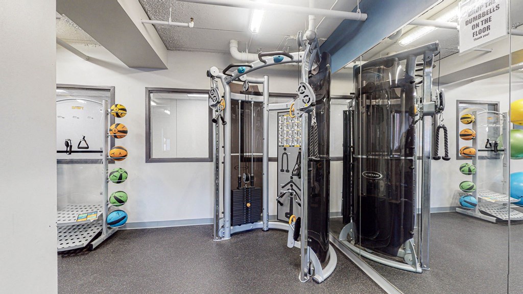 fitness center with weights at Bierman Place, Minneapolis, MN