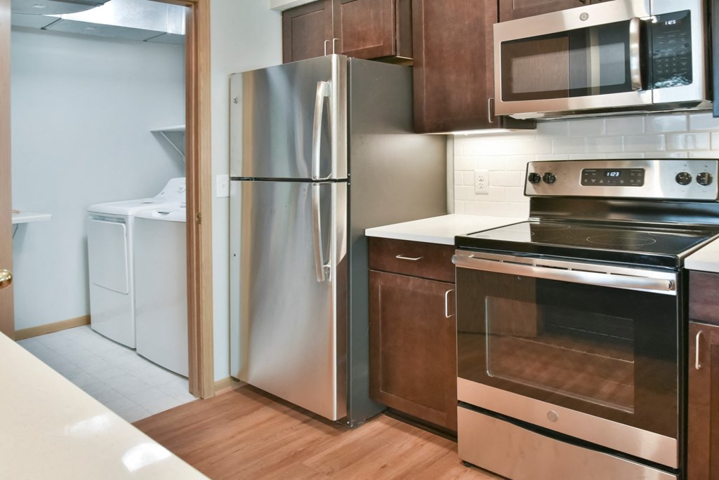 1 bedroom kitchen and laundry room with full size washer and dryer