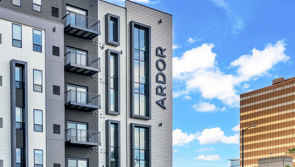 A modern building with the word ARDOR on the side.