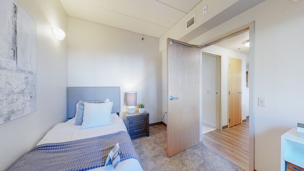 a bedroom with a bed and a closet at Bierman Place, Minneapolis, Minnesota