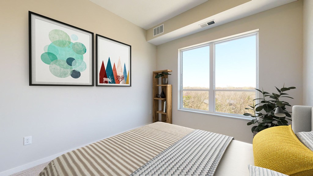 a bedroom with a large window and two paintings on the wall