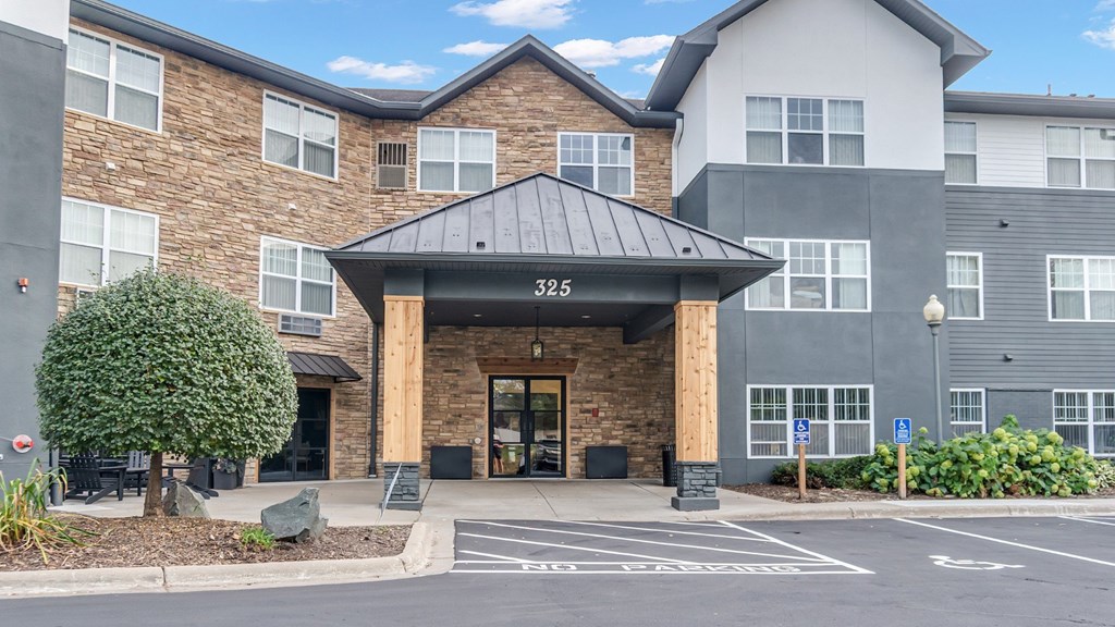 The image shows a building with the number 325 on it.