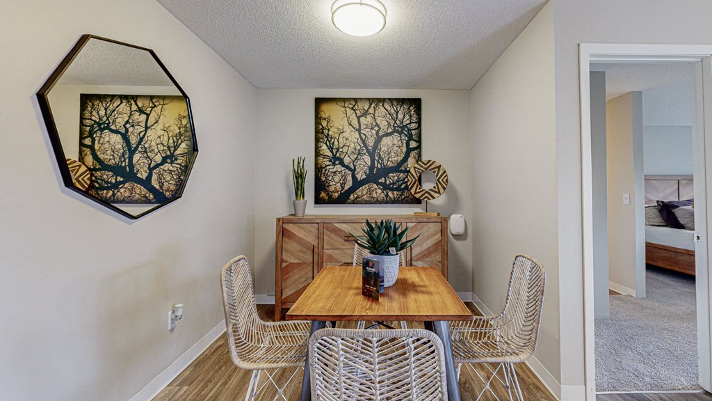 a dining room with a table and chairs