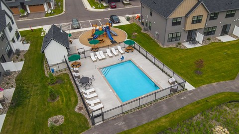 A residential area with a pool and a playground.