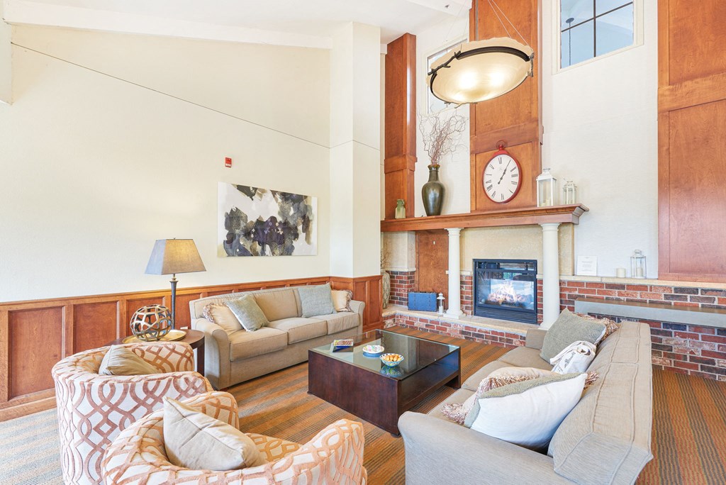 a living room with couches and a fireplace