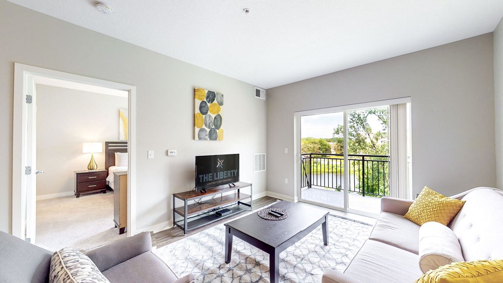 a living room with a couch and a coffee table and a tv