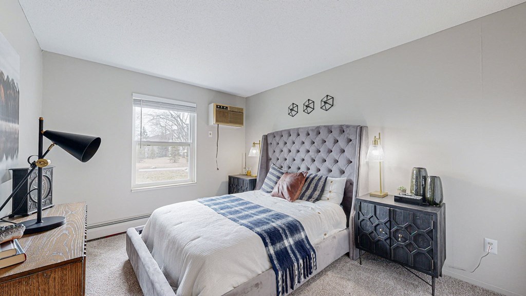 a bedroom with a large bed and a window a bedroom with a large bed and a window