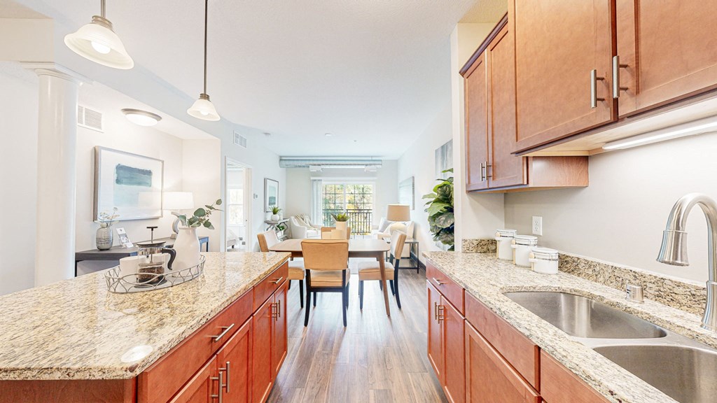 a kitchen with wooden cabinets and granite counter tops at Victoria Flats, Victoria, MN