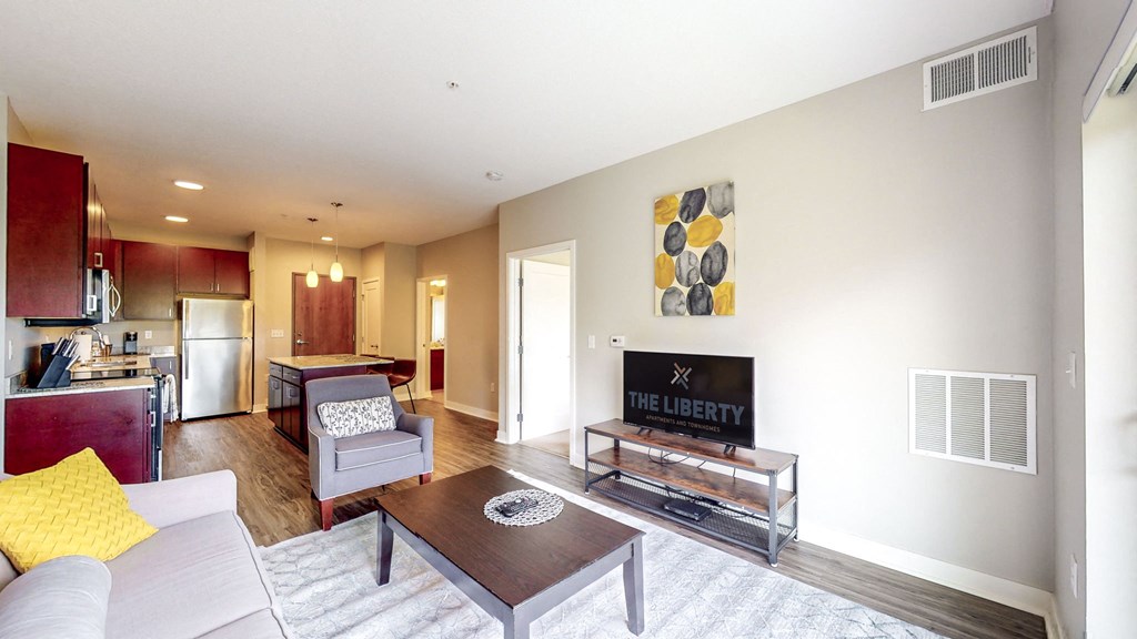 a living room with a couch and a table and a fireplace