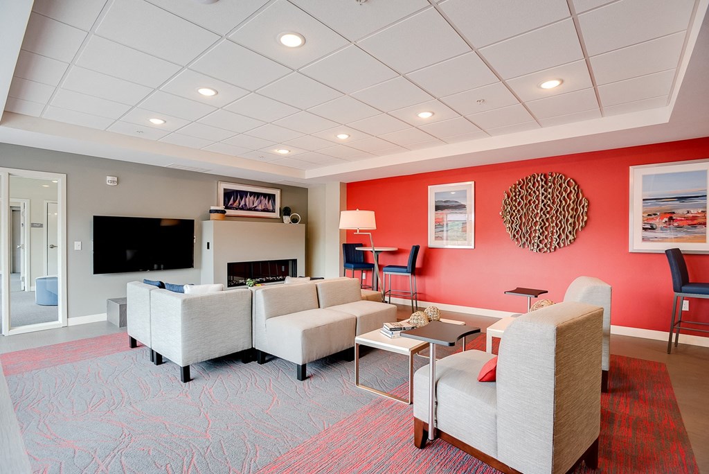 Community room with seating, tv and fireplace at Lake Jonathan Flats, Chaska, 55318