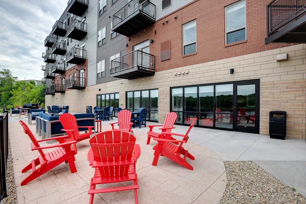 Outdoor patio with grilling and seating at Lake Jonathan Flats, Chaska