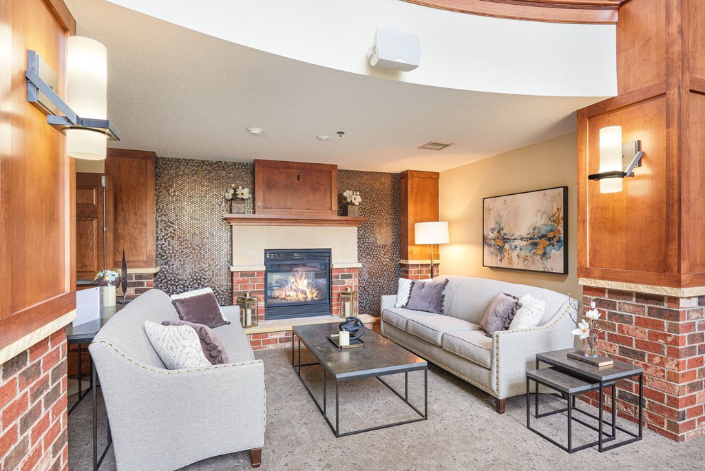 a living room with couches and a fireplace