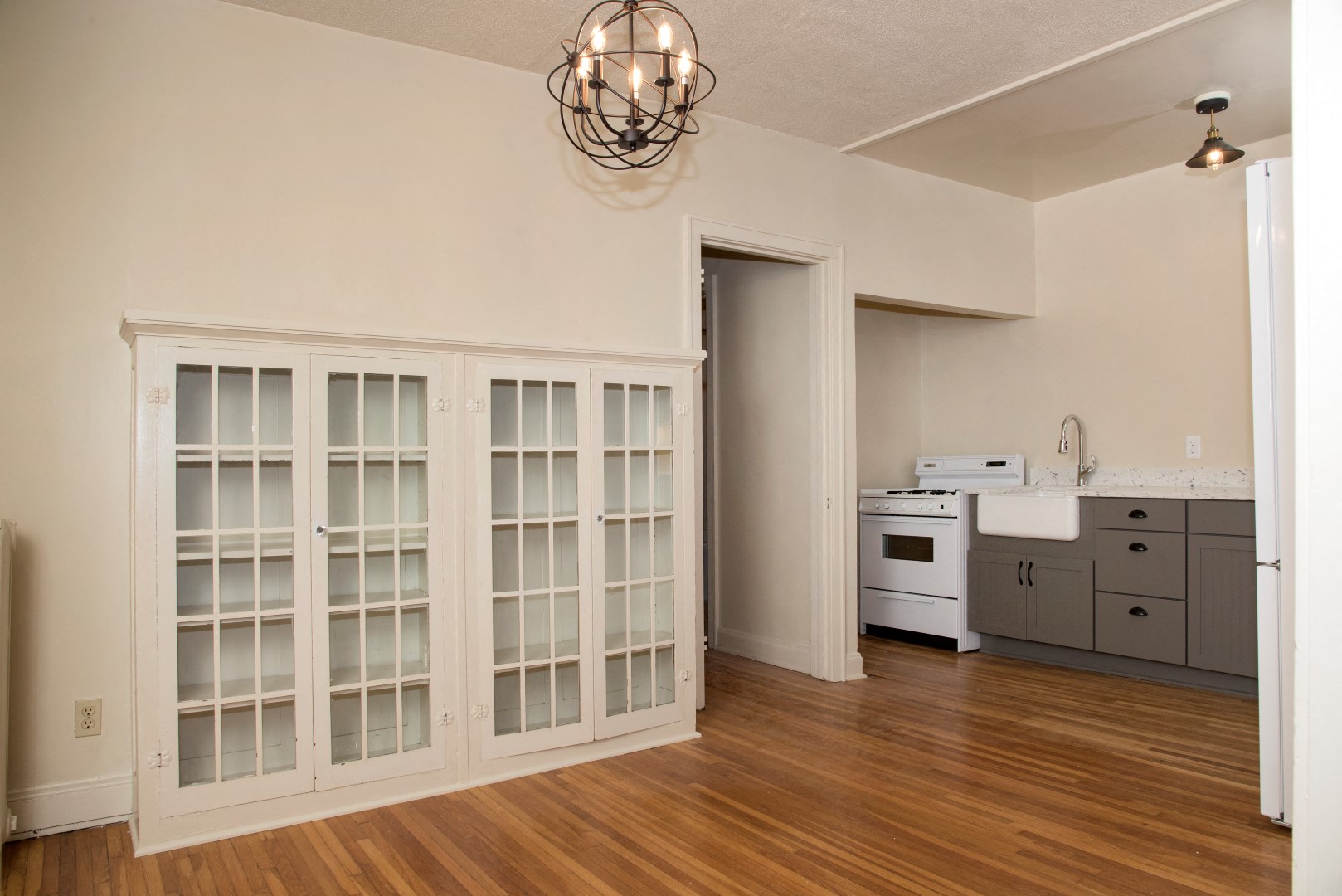 Built-in White Cabinetry in Dining Room of Apartment in Minneapolis, MN