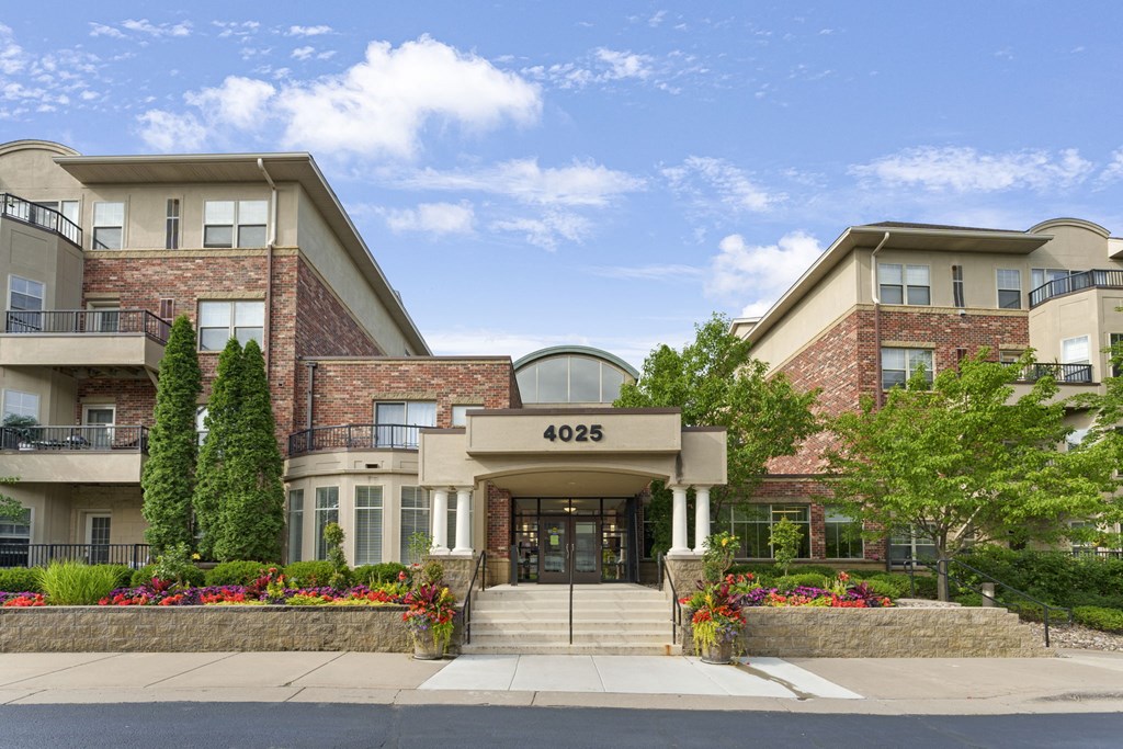 the 4008 building has a large building with a stone facade and a large entrance