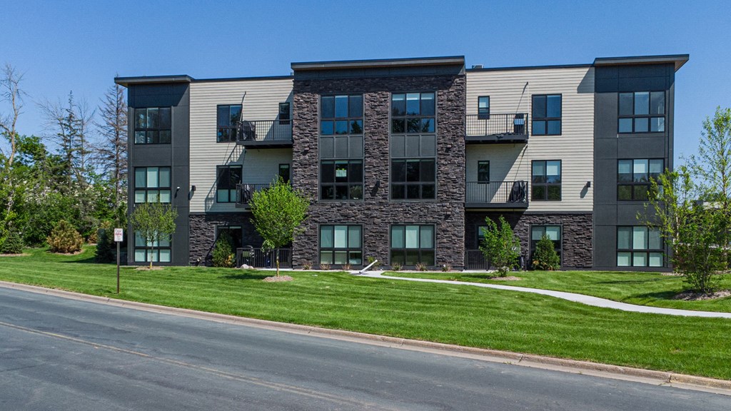 an apartment building on the side of a street