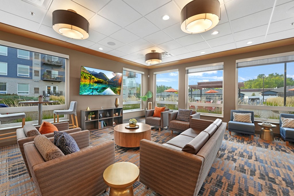 a room filled with furniture and a large window