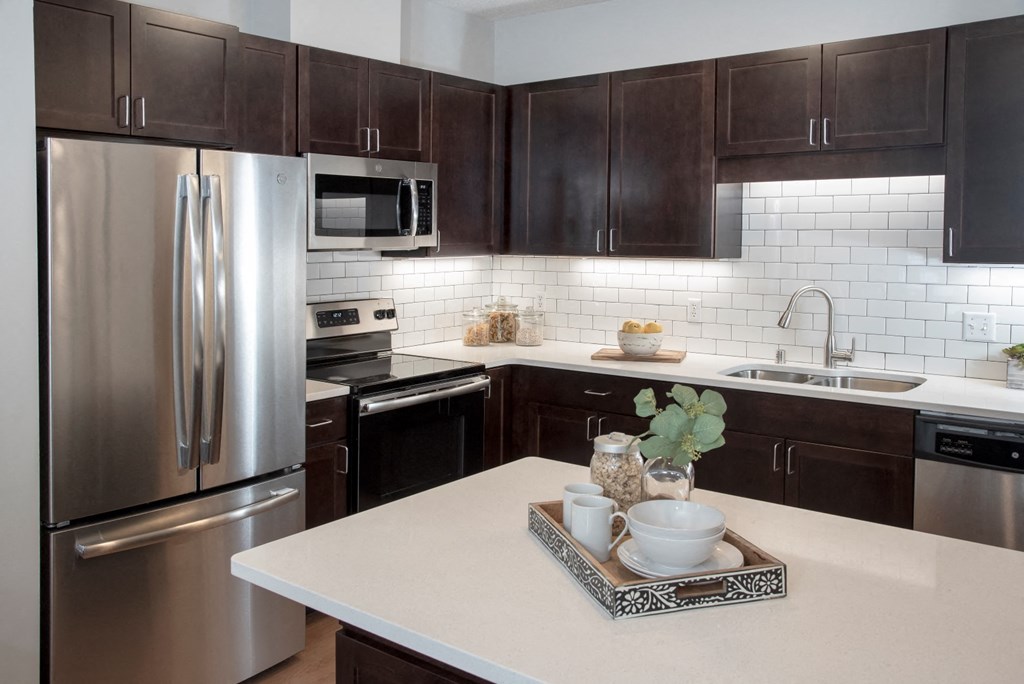 upgraded kitchens with breakfast bar in select townhomes