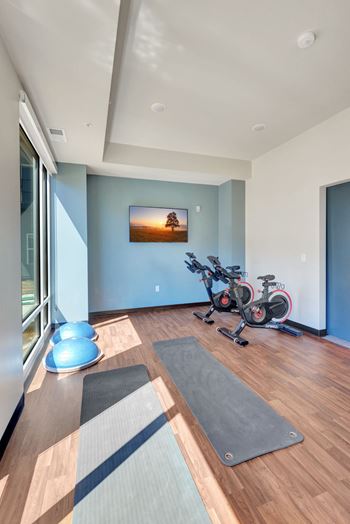 A room with a wooden floor and a picture on the wall at Lochner Apartments, White Bear Lake, 55110