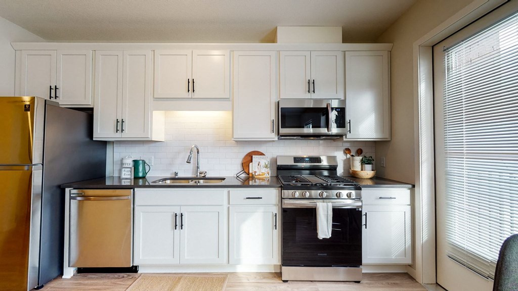 Fully Equipped Kitchen Includes Frost-Free Refrigerator, Electric Range, & Dishwasher at Shady Oak Crossing, Minnetonka, Minnesota