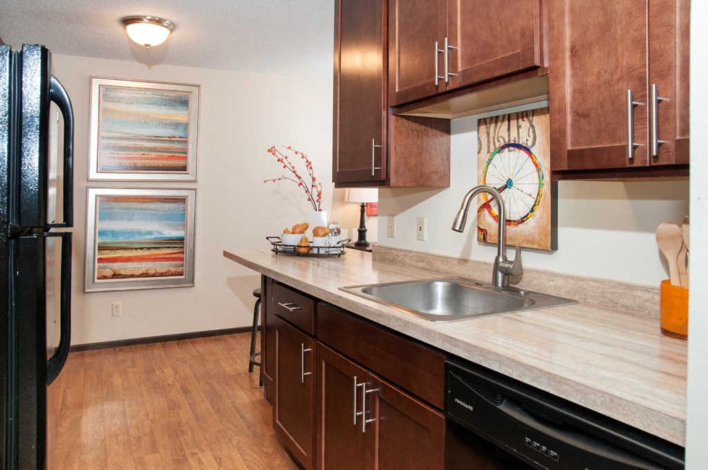 600 10th Avenue Kitchen with Wood Cabinetry and Black Appliances