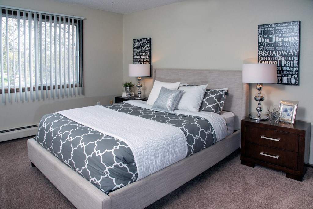Bright Bedroom with Large Windows at 600 10th Ave Apartments