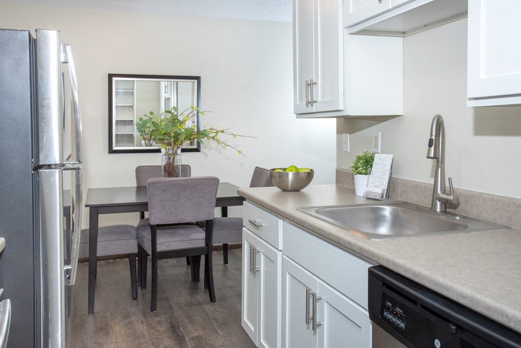 600 10th Ave Apartment Kitchen with Stainless Steal Appliances and White Cabinetry