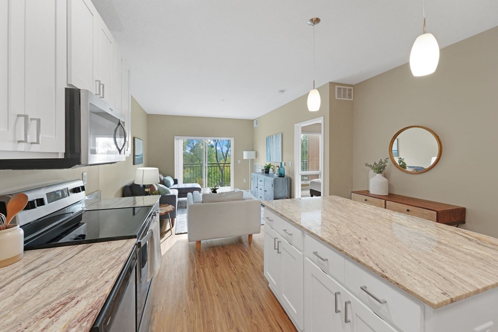 a kitchen and living room in a 555 waverly unit