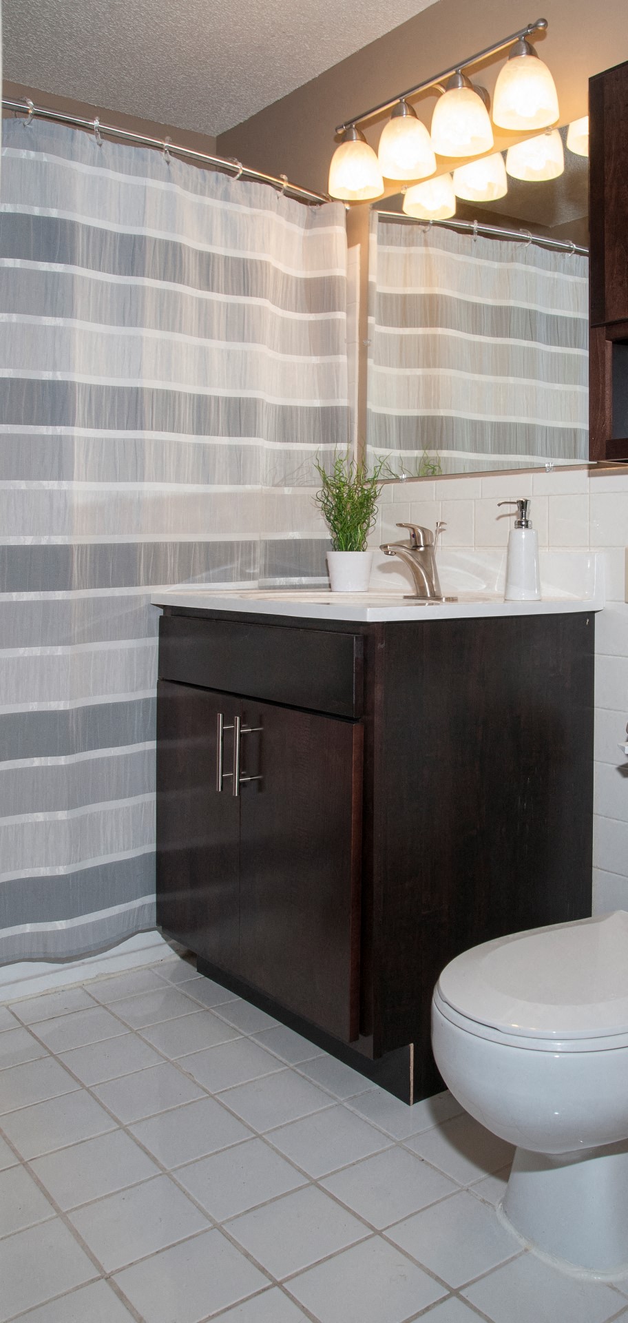 624 Huron Boulevard Apartment White Tile Bathroom with Tall Shower