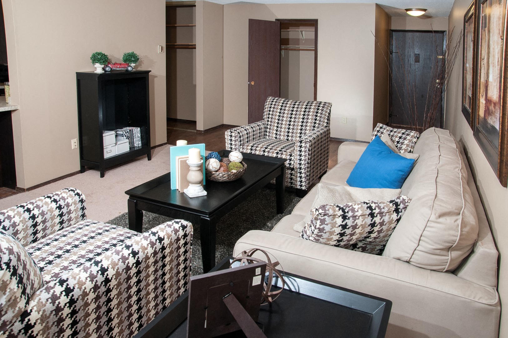 Spacious Living Room with Light Carpet and Front Door Access at 624 Huron Boulevard