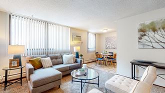 a living room with a couch coffee table and chairs