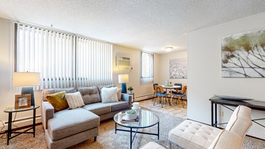 a living room with a couch coffee table and chairs