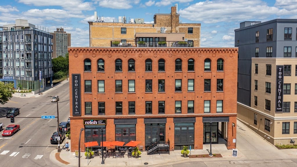 a red brick building with a black sign that says radisson on the side of it